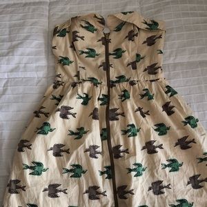 Cute dress with birds flying pattern.